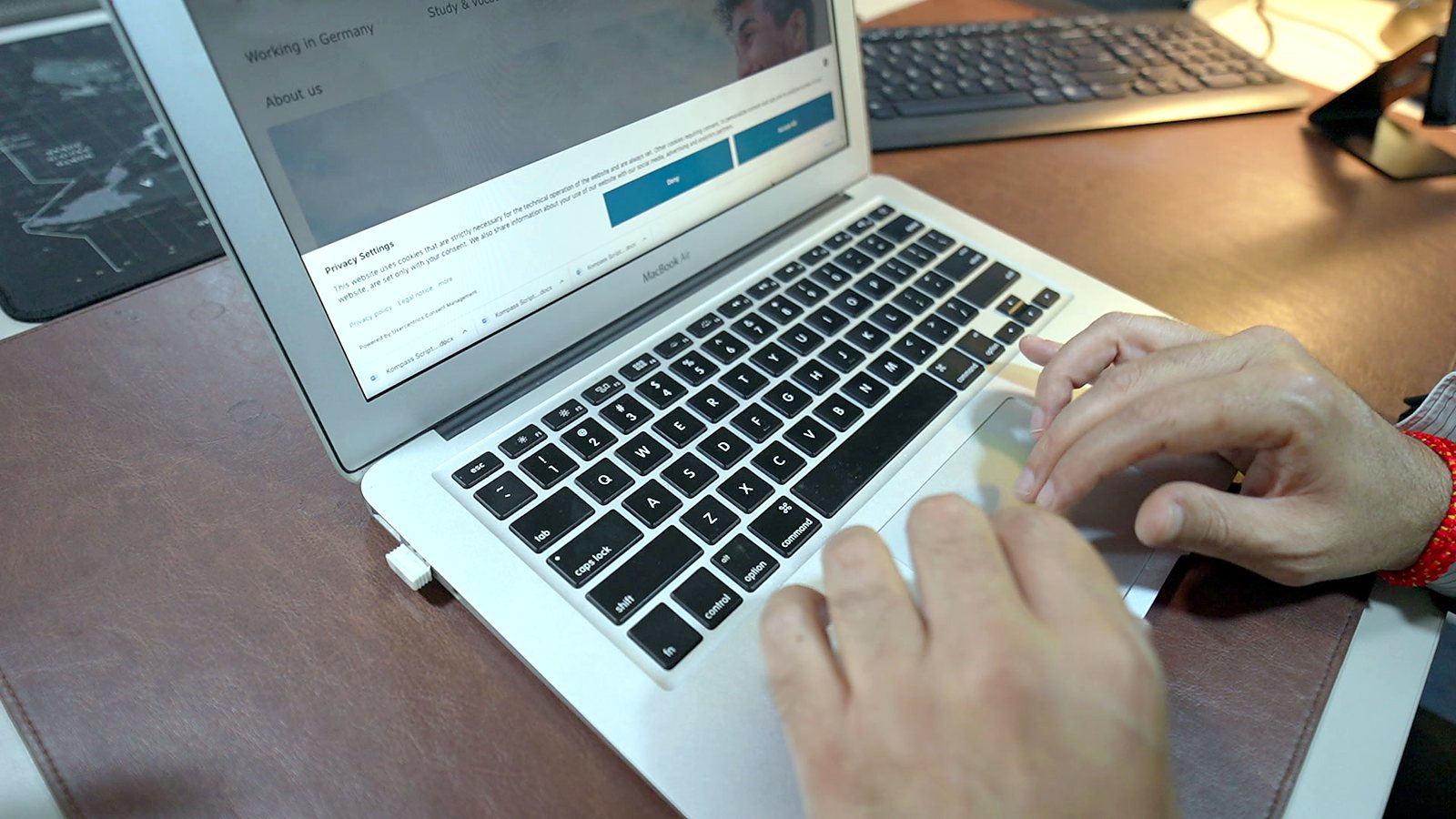 Working on a laptop during a remote consultation