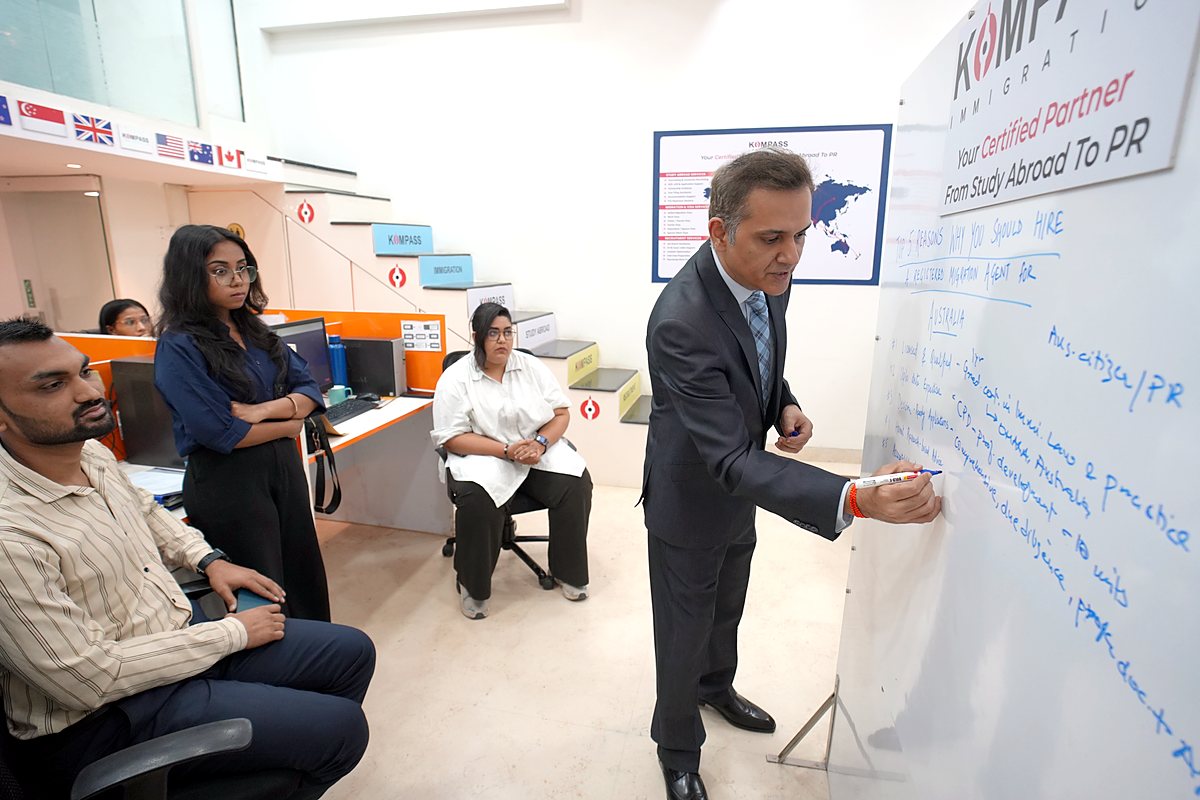Sumit Kumar leading a strategy session at the whiteboard